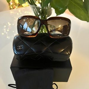 Chanel sunglasses. New with box. Deep brown with white pearl Chanel sign